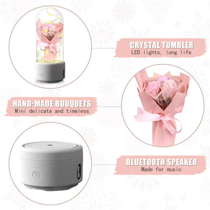 Crystal tumbler with LED lights, hand-made bouquets, and Bluetooth speaker on a white background