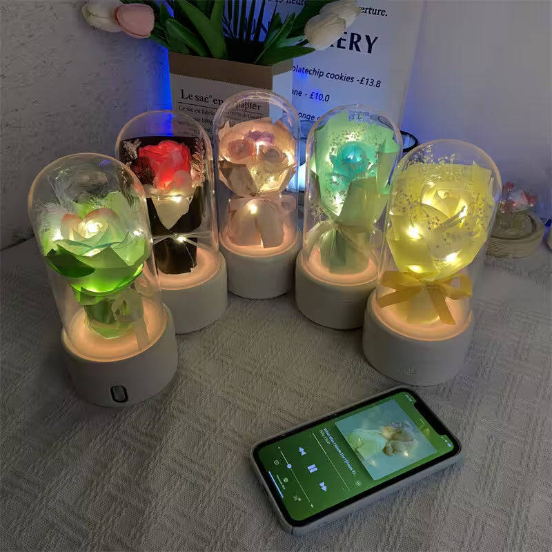 Decorative lights with colorful LED lights on a surface next to a smartphone.