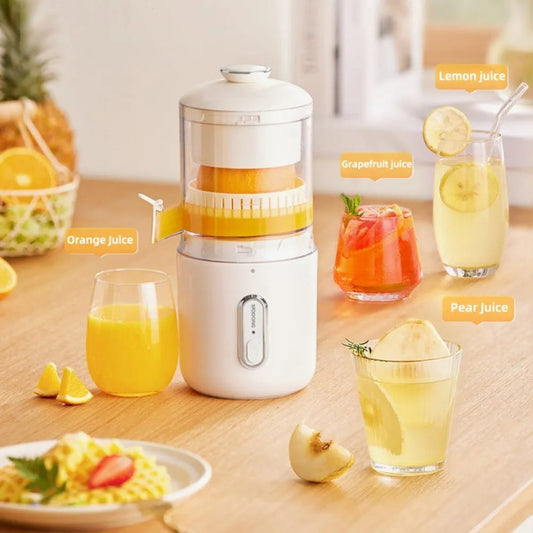 Juicer with glasses of orange, grapefruit, and pear juice on a wooden table.