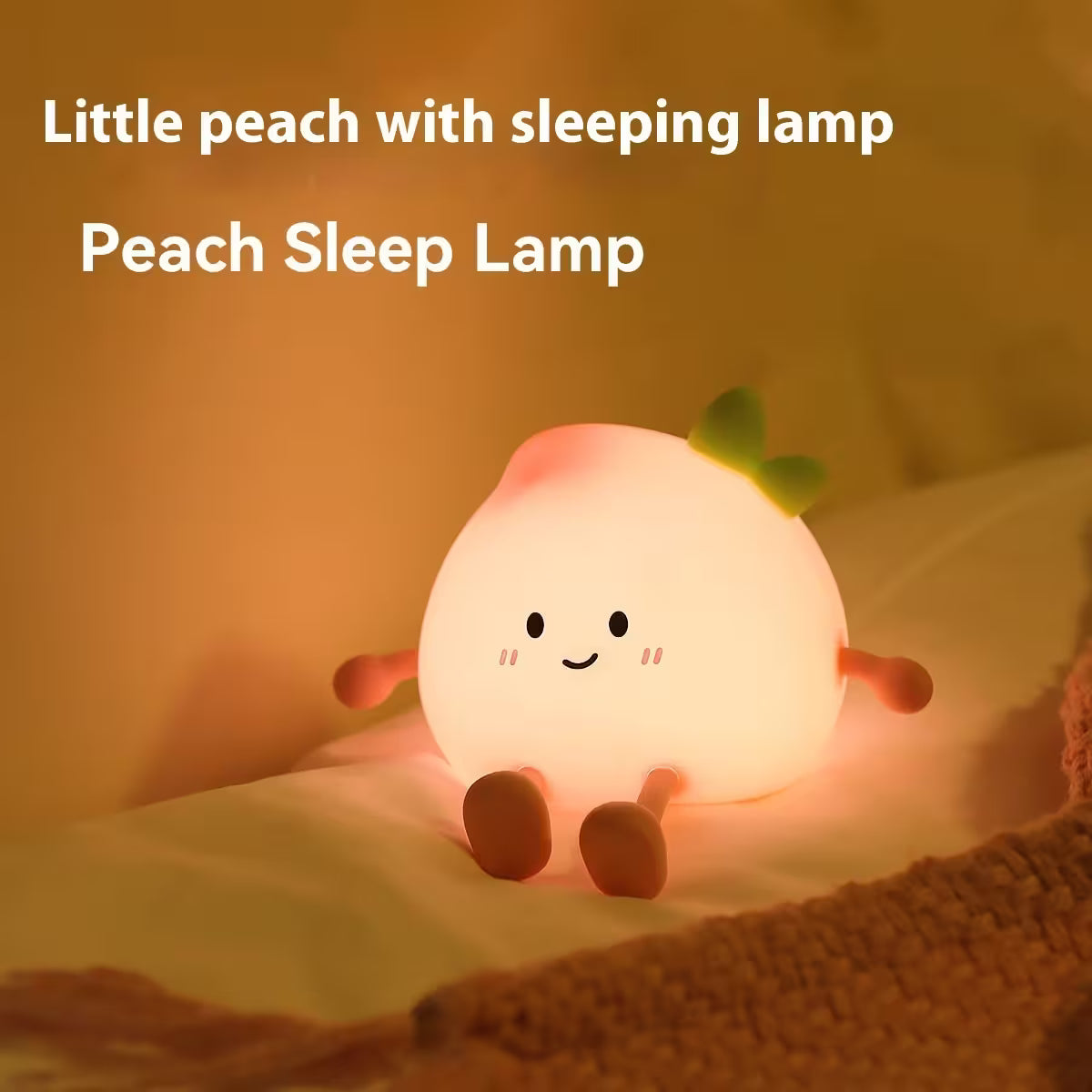 Peach-shaped sleep lamp with a smiling face on a soft surface