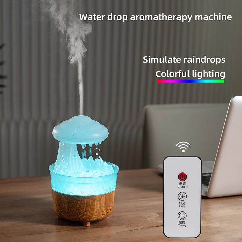 Water drop aromatherapy machine emitting mist with a remote control on a wooden surface.