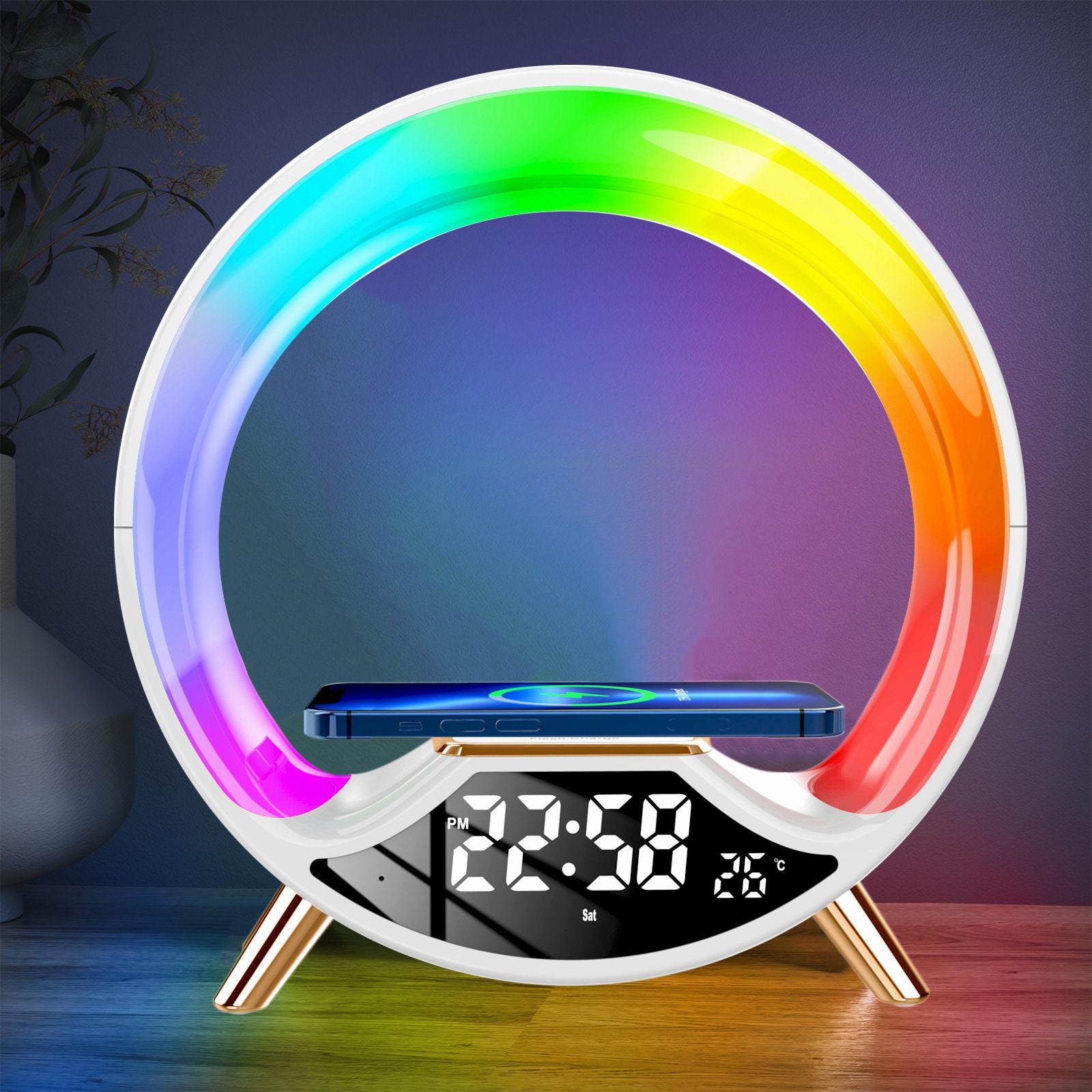 Colorful circular LED lamp with digital clock and phone stand on a dark background