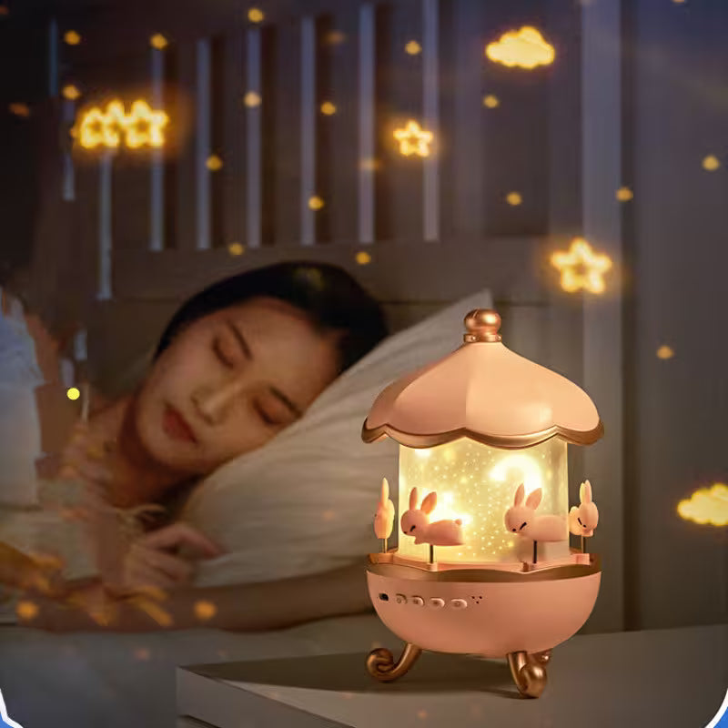 Woman sleeping with a decorative lamp featuring rabbits on a nightstand.