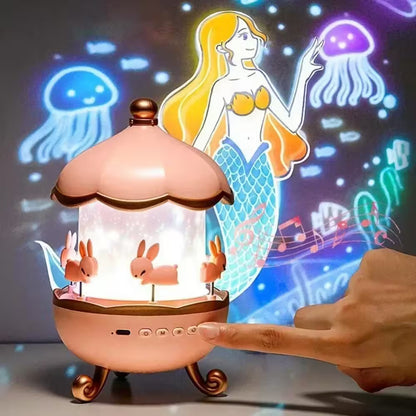 Decorative lamp with mermaid and jellyfish projection, hand interacting with it.