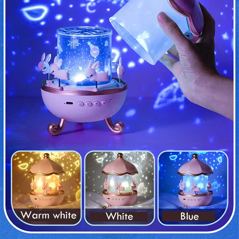 Children's night light with rabbit design, held by a hand against a blue background.