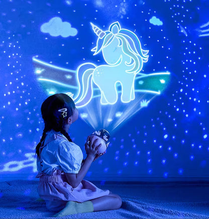 Child sitting on a bed with a unicorn projection lamp casting a blue light on the wall.