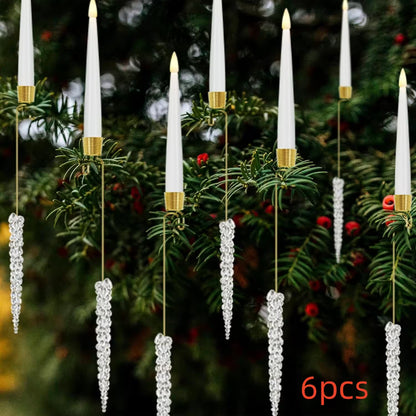 Decorative candles with gold bases on a Christmas tree background