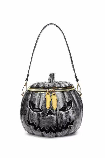 Pumpkin-shaped bag with a face design on a white background