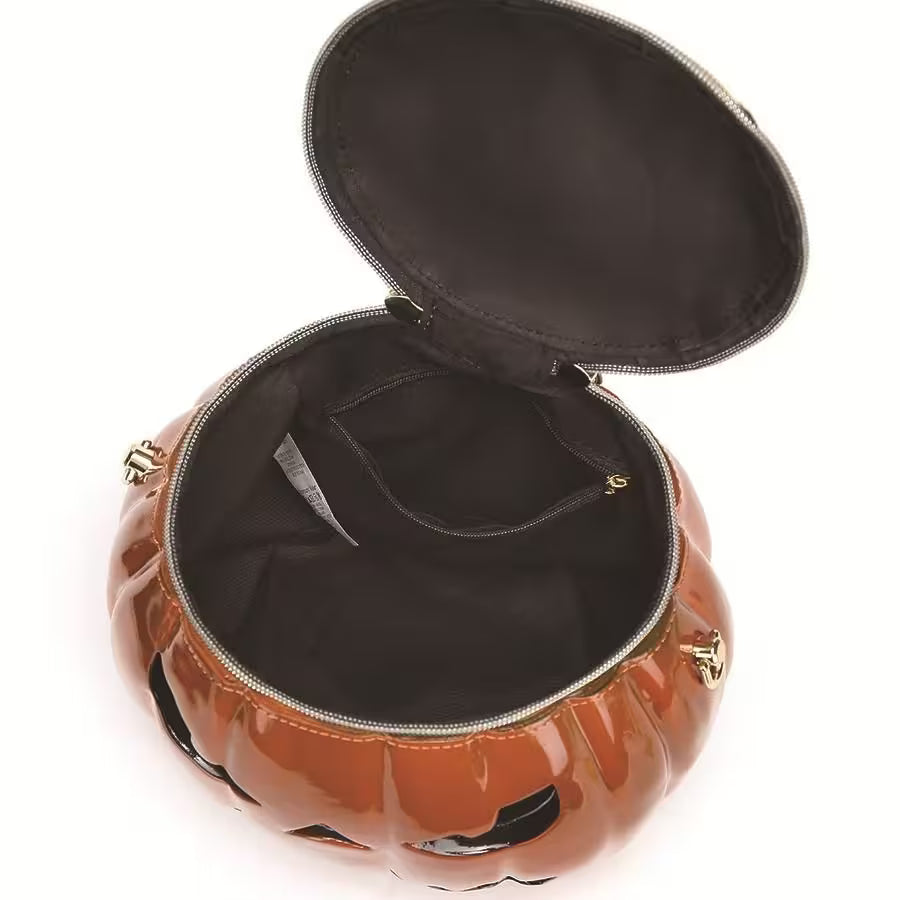 Pumpkin-shaped bag with open lid on a white background