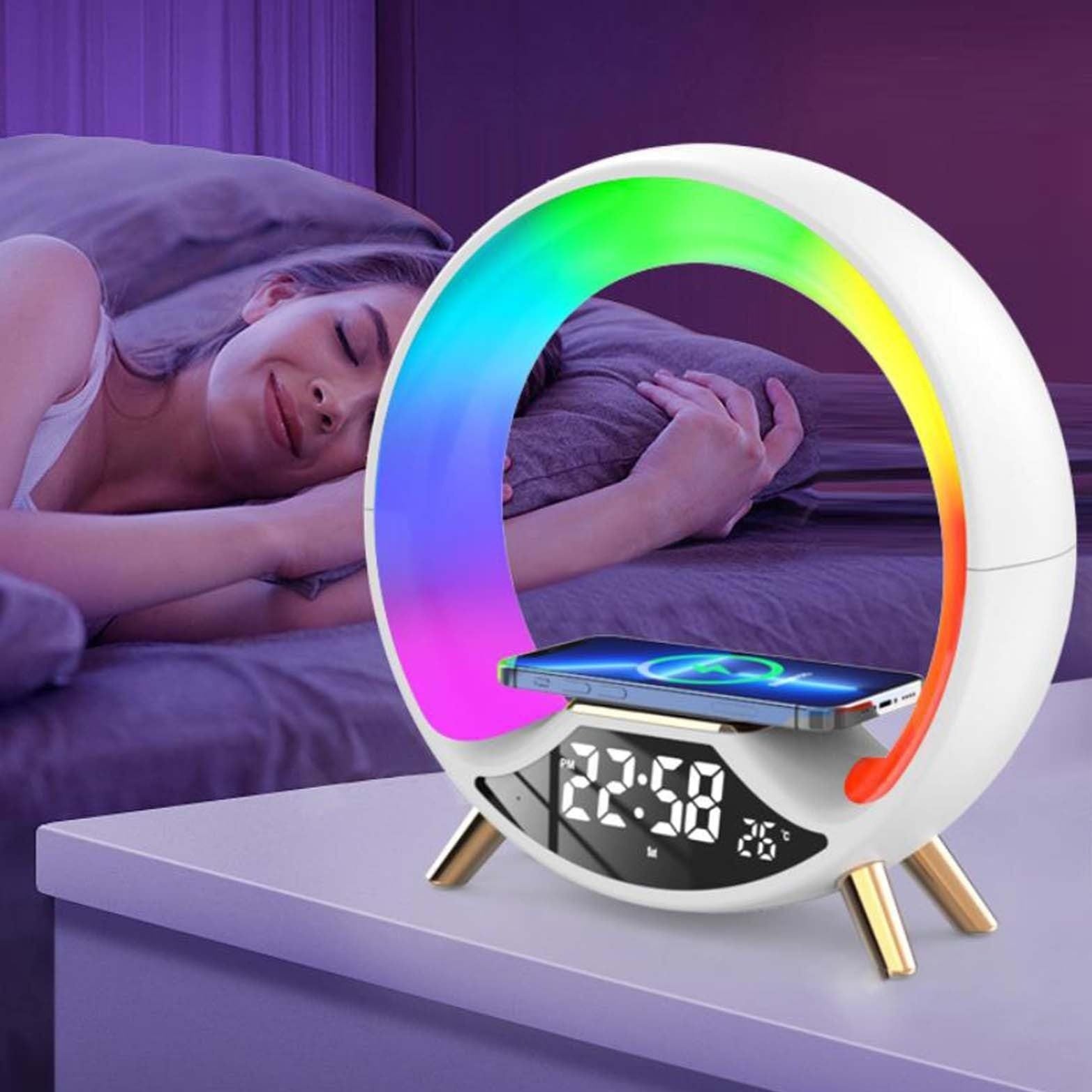 Multicolored LED night light with digital display on a bedside table, showing a person sleeping in the background.