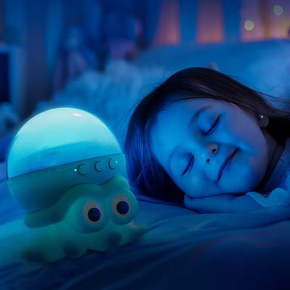 Child sleeping with a glowing octopus-shaped night light in a dimly lit room.