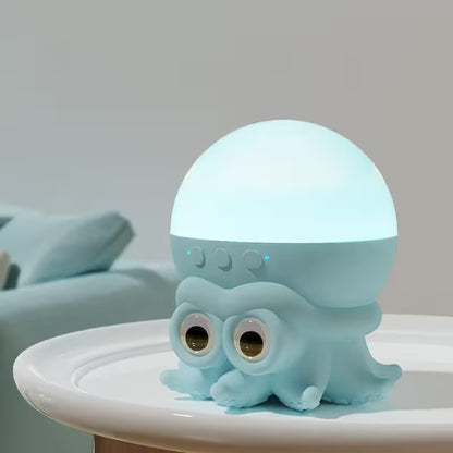 Light blue octopus-shaped night light on a white surface with a neutral background