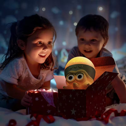 Two children looking at a glowing toy in a dark room