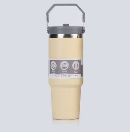 Beige tumbler with a gray lid on a light gray background