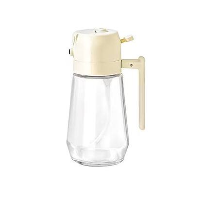 Clear glass bottle with beige cap and nozzle on a white background