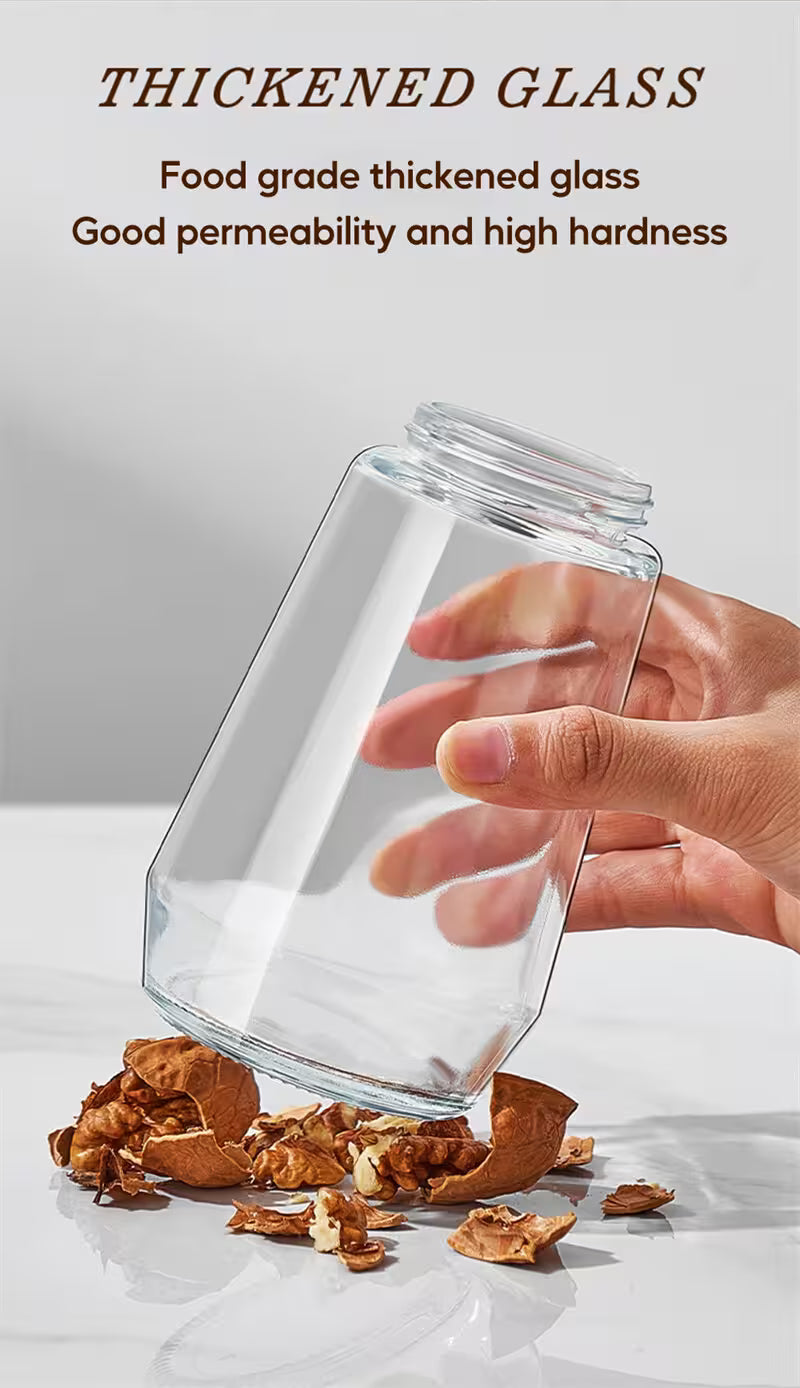 Clear glass jar being held by a hand with a white background, showcasing food-grade thickened glass.