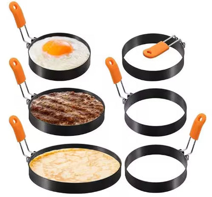 Set of pancake rings with orange handles on a white background