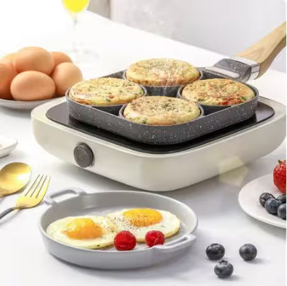 Multifunctional cooking appliance with muffin and egg dishes on a table.