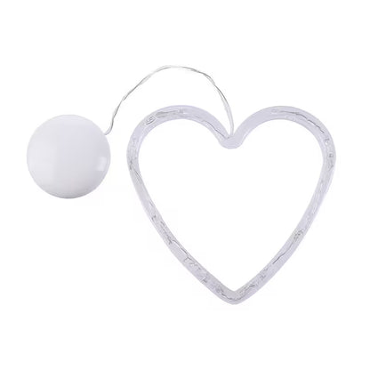 Heart-shaped light fixture with a white bulb on a white background