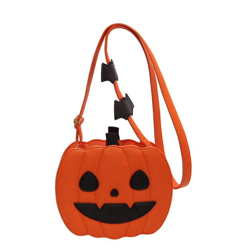 Pumpkin-shaped bag with a face design on a white background