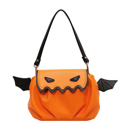 Orange Halloween purse with black bat wings on a white background