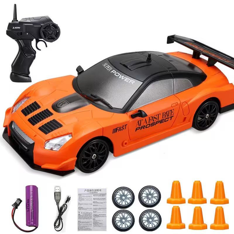 Orange toy car with remote control, battery, and accessories on a white background