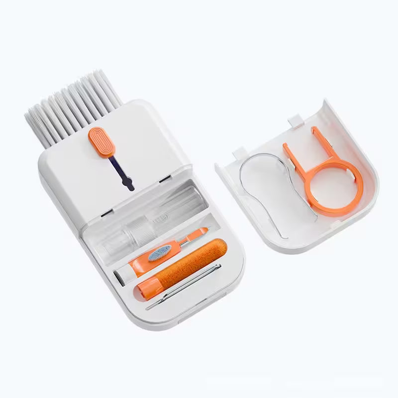 Set of cleaning tools including a brush, scrubber, and small tools in an open white case on a white background.