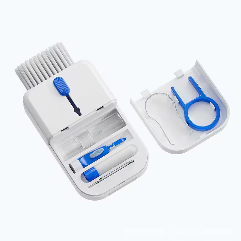 Set of dental cleaning tools including brushes and holders on a white background