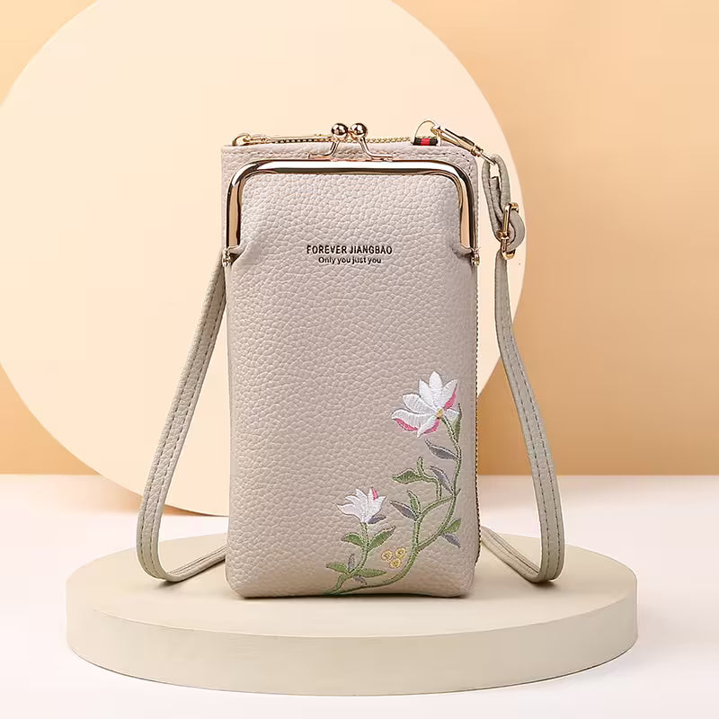 Beige handbag with floral embroidery on a beige background