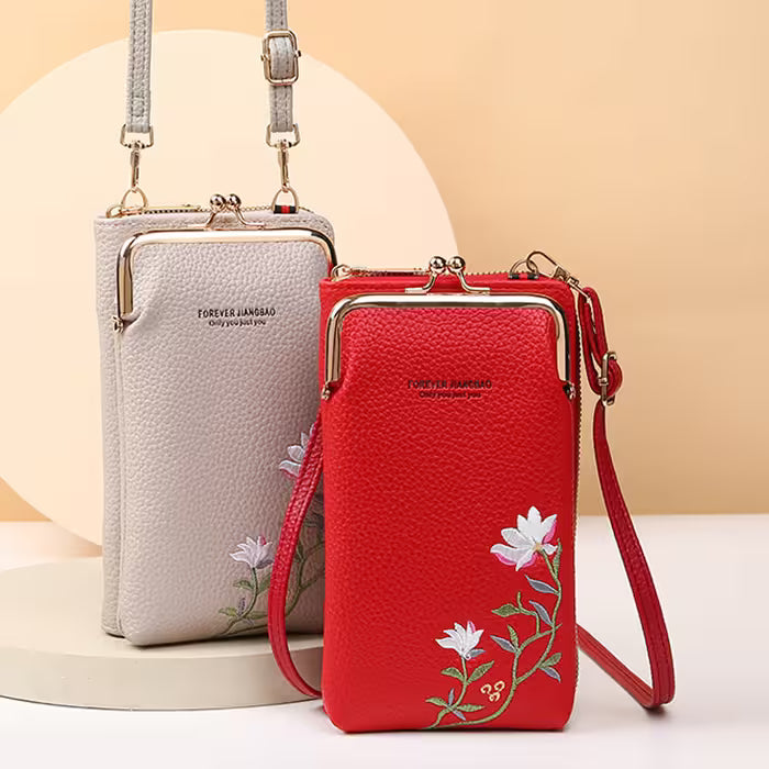 Two handbags, one red and one gray, with floral embroidery on a beige background.