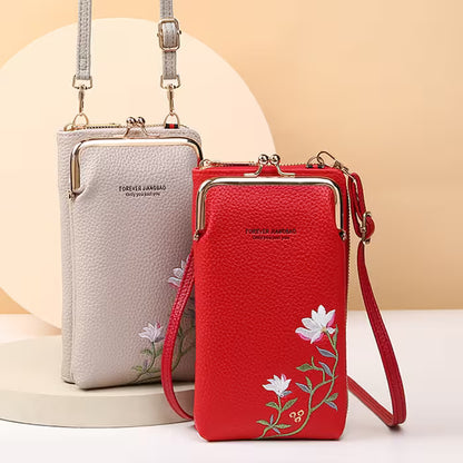 Two handbags, one red and one gray, with floral embroidery on a beige background.