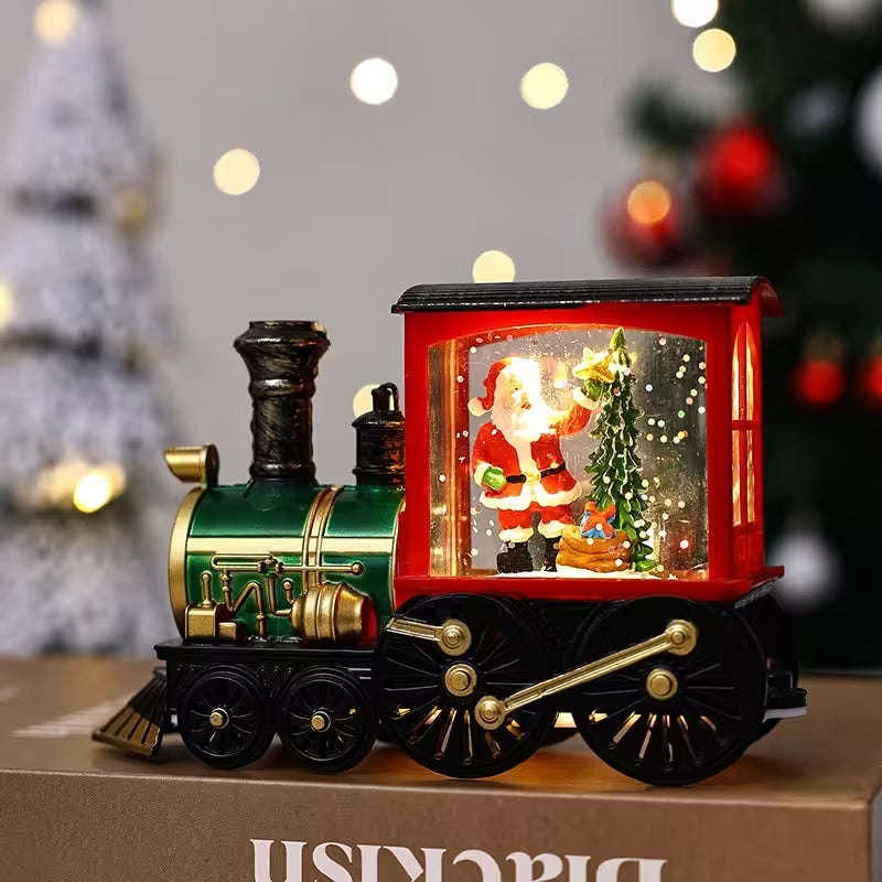 Decorative train with a Santa Claus figure in a glass case, set against a festive background.
