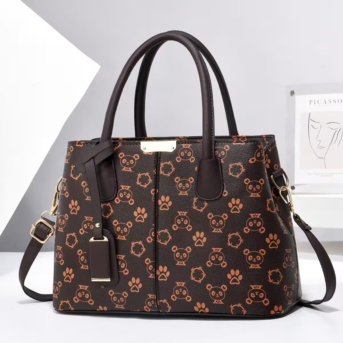 Brown handbag with animal pattern on a white background