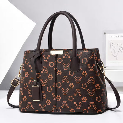 Brown handbag with animal pattern on a white background