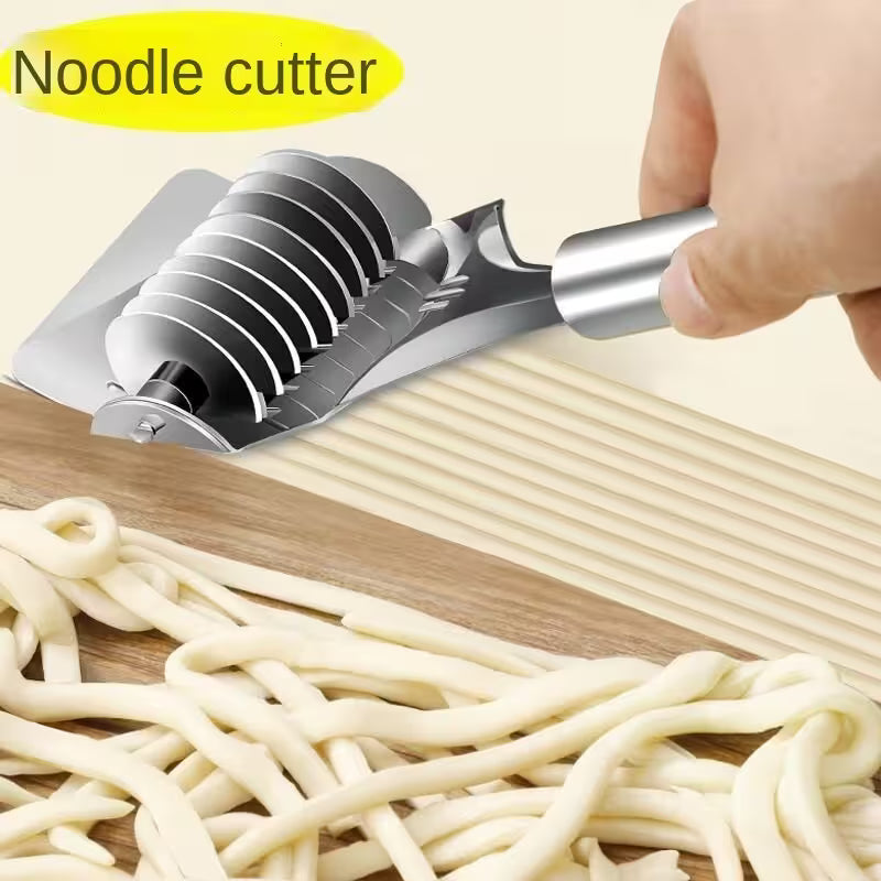Noodle cutter with freshly made noodles on a wooden surface