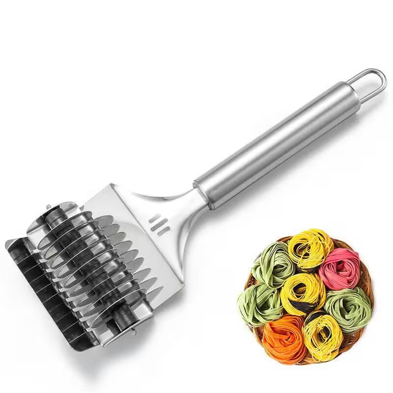 Metal pasta maker with colorful pasta on a white background