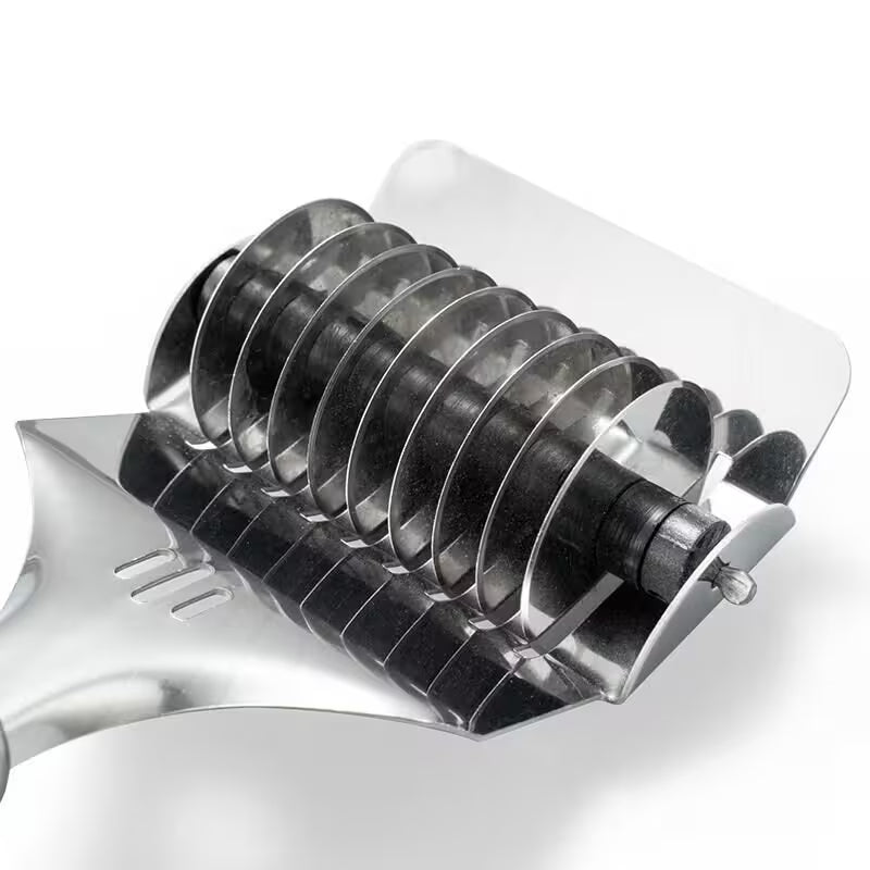 Metallic hair dresser comb on a white background