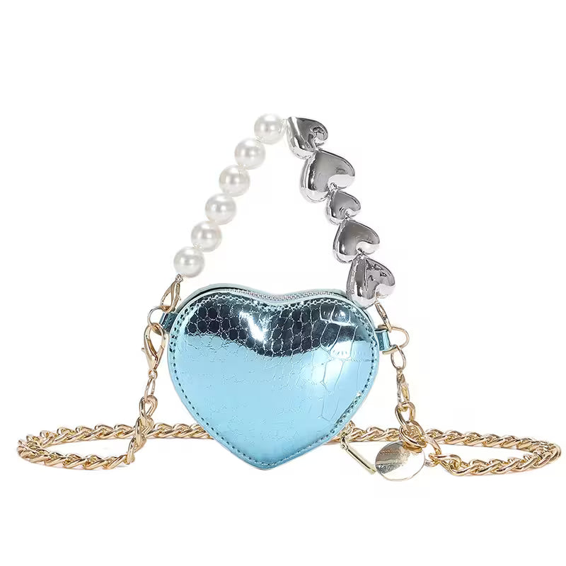 Heart-shaped blue mirror bag with pearl and silver chain on a white background
