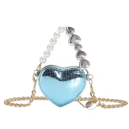 Heart-shaped blue mirror bag with pearl and silver chain on a white background