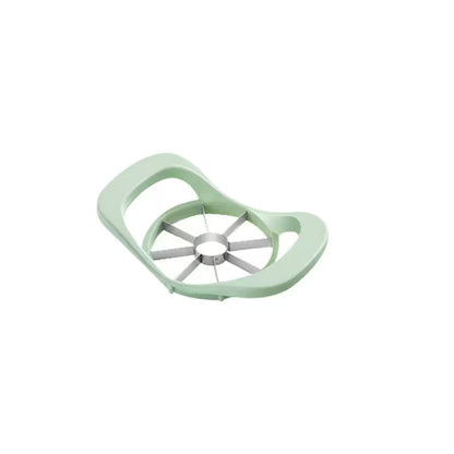 Green apple peeler on a white background
