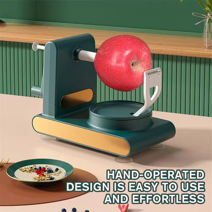 Hand-operated apple peeler with a red apple on a kitchen counter.