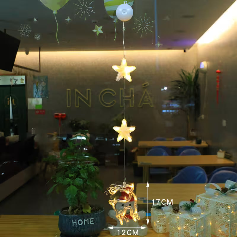 Decorative lights hanging above a table with 'IN CHA' visible on the wall.