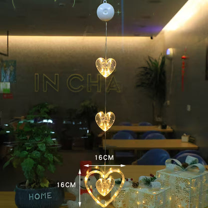 Heart-shaped string lights on a table with a blurred indoor background