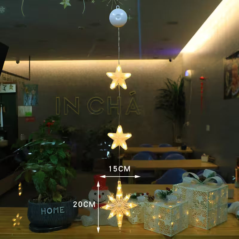 Decorative star-shaped lights on a table with measurements and 'IN CHA' branding.