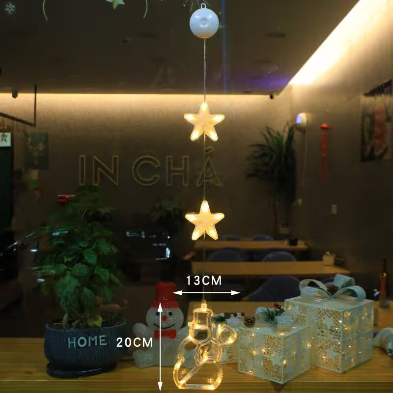 Decorative string lights with star-shaped bulbs hanging in a room with 'IN CHA' branding.