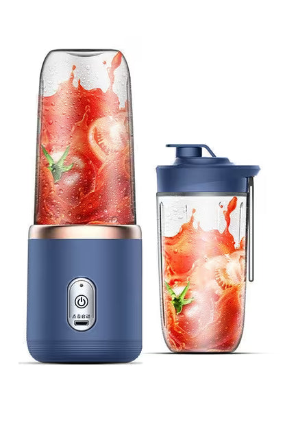 Blue portable blender with a container filled with a fruit smoothie on a white background