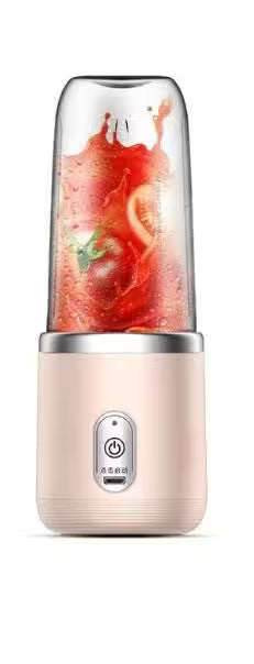 Portable blender with a smoothie inside on a white background