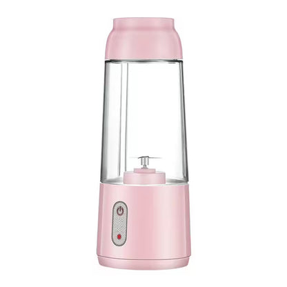 Pink portable blender on a white background