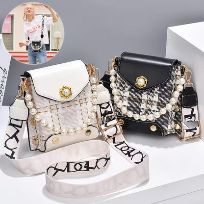 Two handbags, one white and one black, with decorative straps and pearls on a gray background.