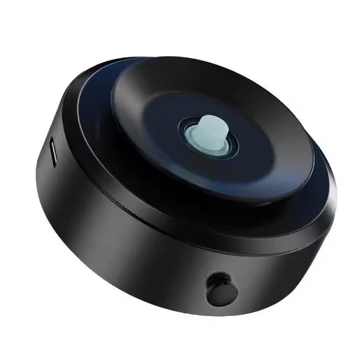 Black electronic device with a circular design on a white background